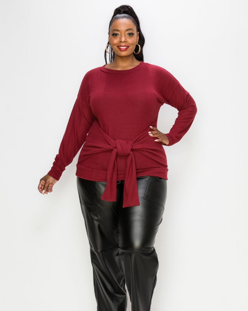 Front of a model wearing a plus size Amy Waist Tie Sweater in Burgundy by L I V D. | dia_product_style_image_id:241571